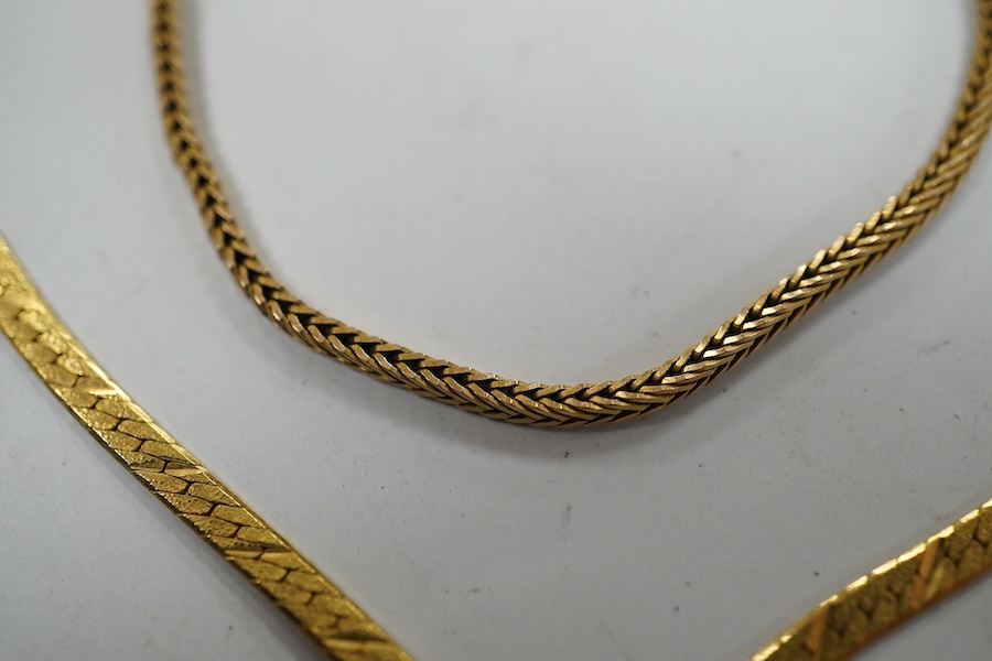 Four assorted 9ct gold chains or necklaces and a 9ct gold bar brooch, 14.7 grams. Condition - fair to good